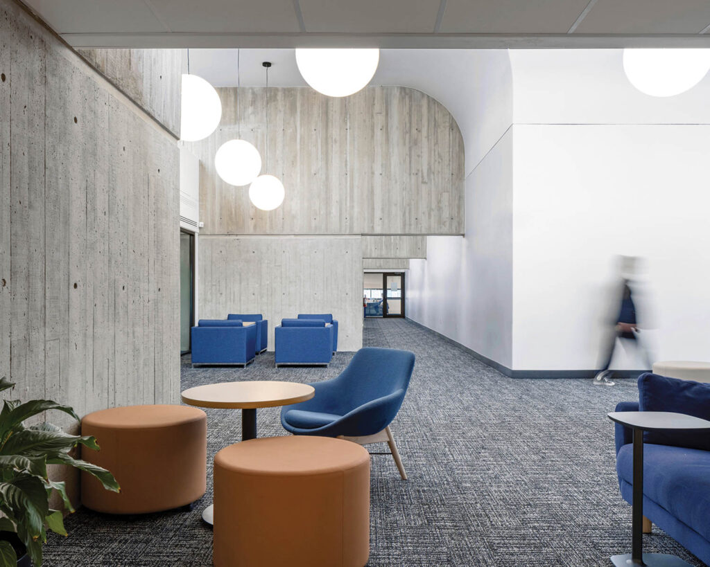 globe pendant lights hang in the Brutalist library of Western University