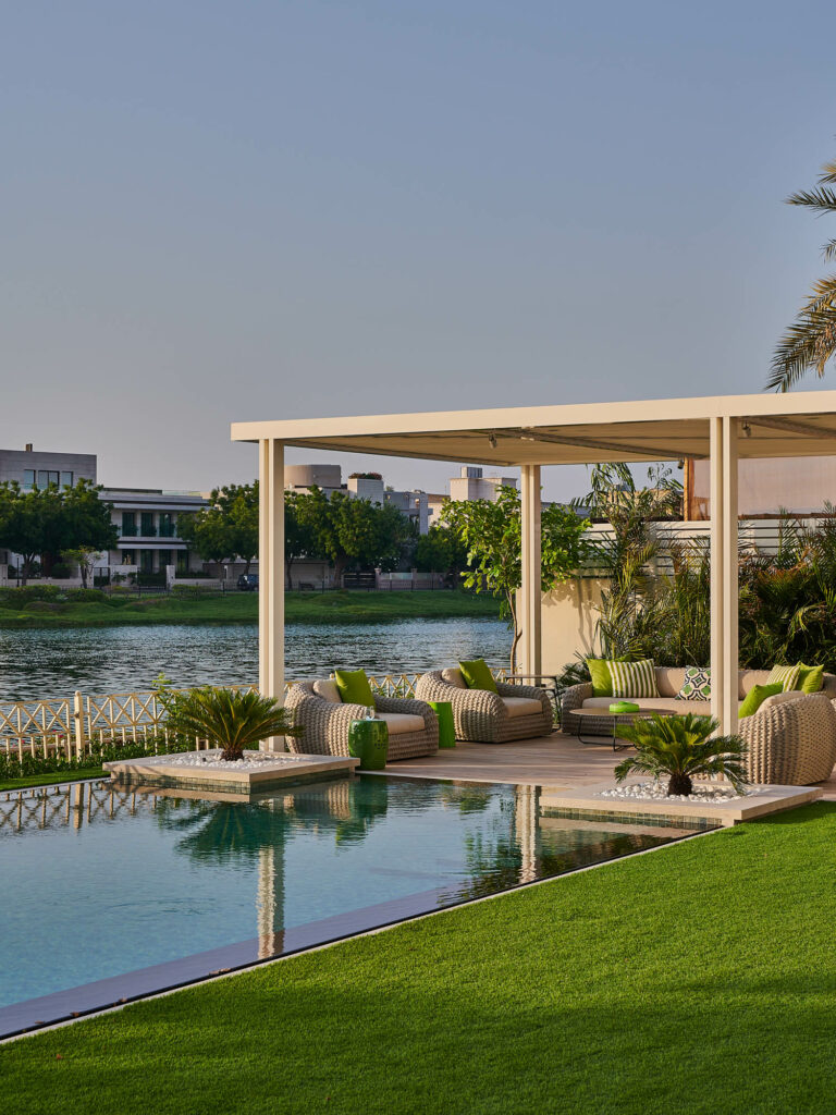 an outdoor seating around by a pool