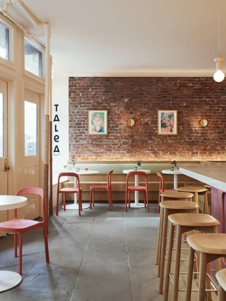 banquett seating near an exposed brick wall