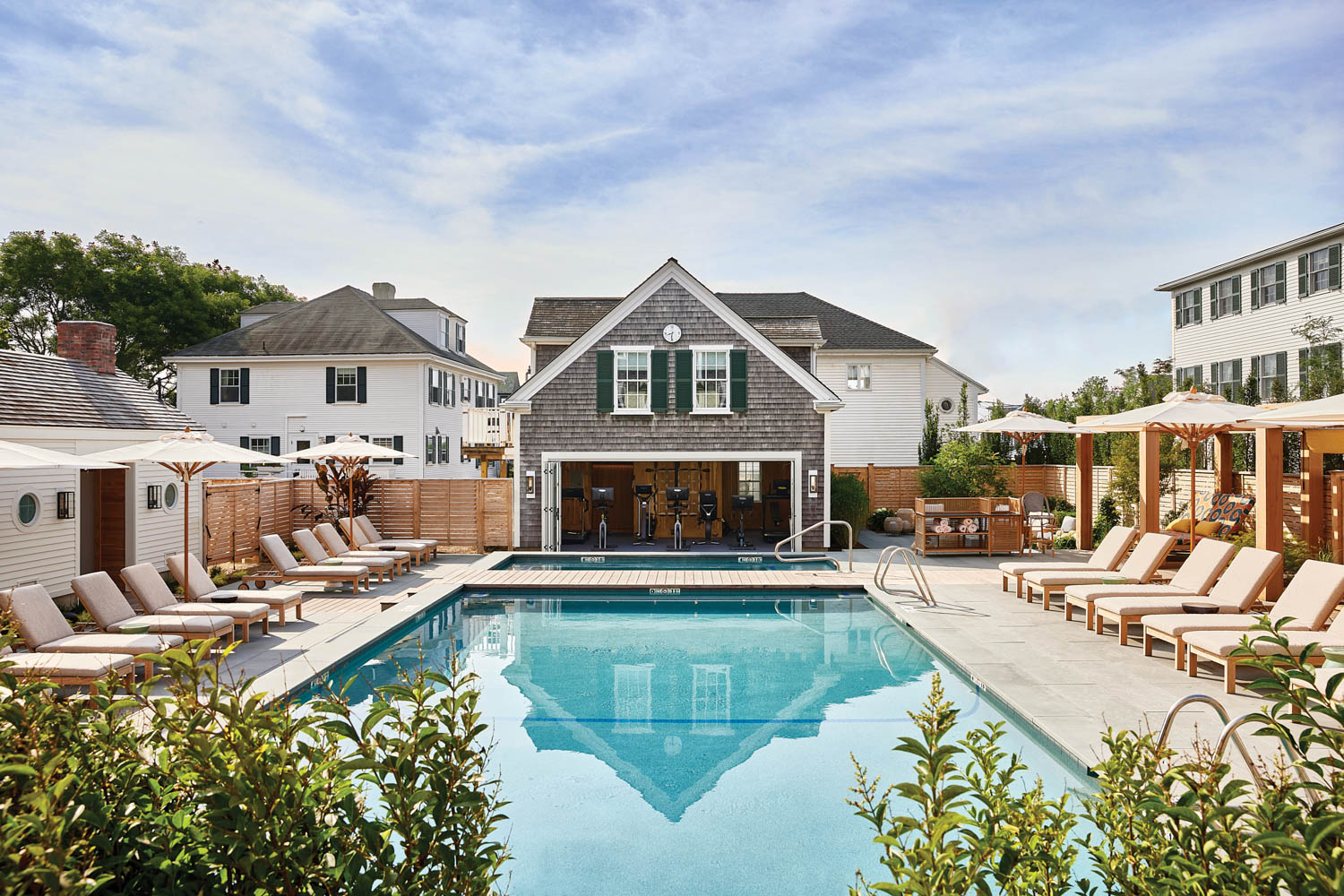 a courtyard pool surrounded by lush plants at Faraway Martha's Vineyard